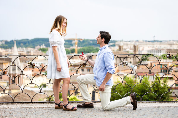 Beautiful couple proposing at sunset on the Pincian Hill in Rome