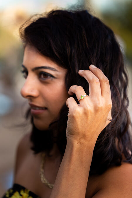 Beautiful girl showing off her engagement ring during a proposal photo session at the Pincio Gardens