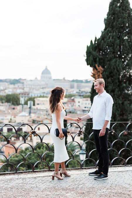 Man declaring his love to his partner during their surprise marriage proposal on the Terrazza Belvedere in Rome