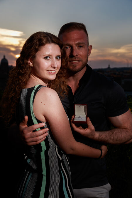 Couple moments after the surprise propsal, showing the ring, on the Capitoline Hill in Rome