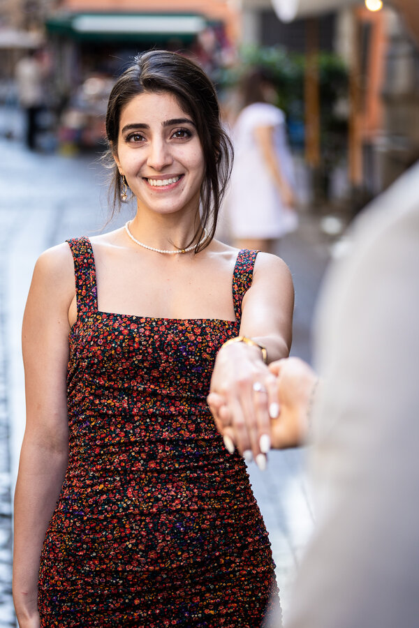 Newly-engaged girl smiling during her proposal photo session in Rome
