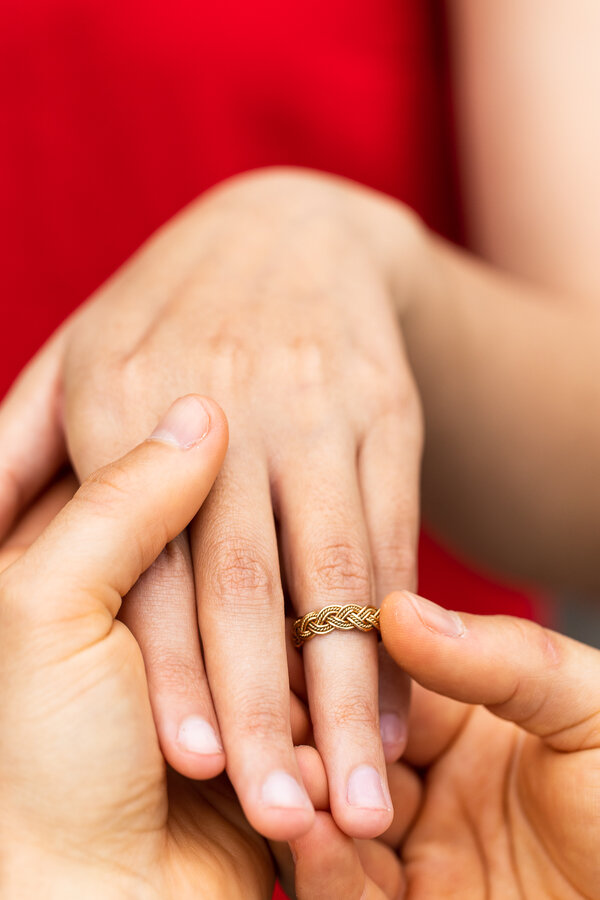 Close-up picture of fiancée's hand with engagement ring in Rome