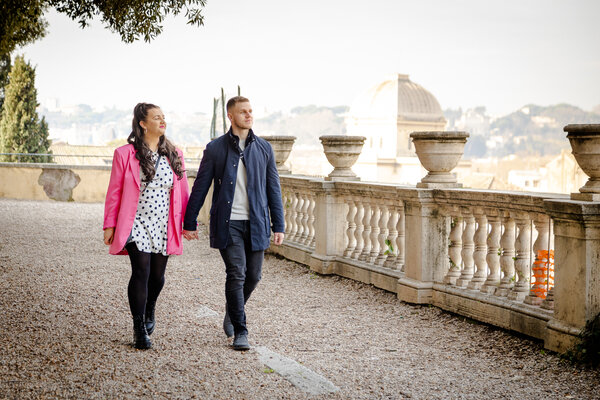 Newly-engaged couple strolling at the Terrazza Caffarelli in Rome