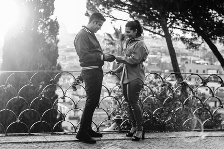Surprise proposal at the Pincio Terrazza Belvedere at sunset in Rome
