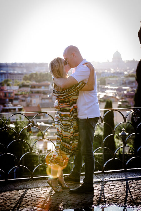 A romantic kiss after a proposal at the Pincio Gardens in Rome