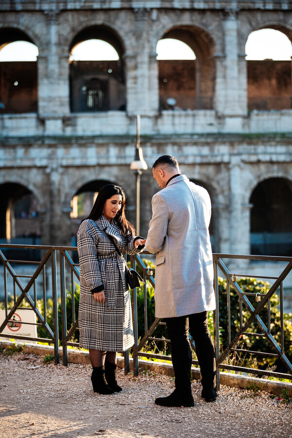 Fitting of the engagement ring with the Colosseum in the background