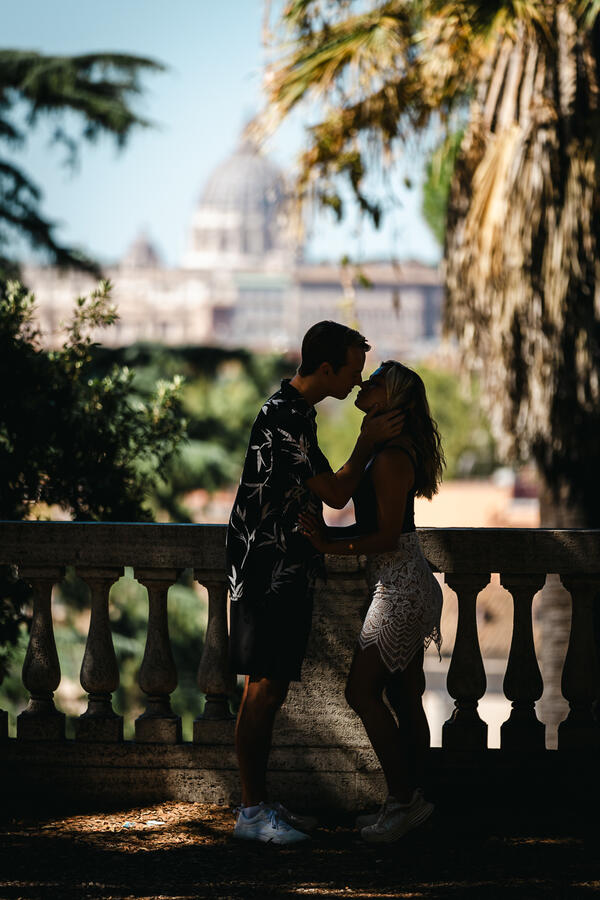Silhouette of newly-engaged couple at the Pincio Gardens with the Vatican in the background