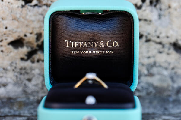 Close-up of a Tiffany diamond ring in its box