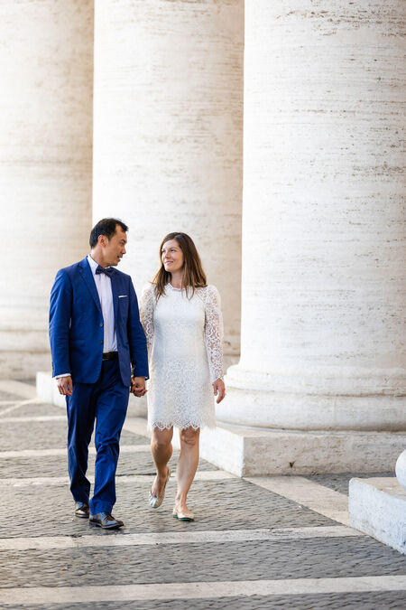 Sposi Novelli walking under St. Peter's Square Colonnade