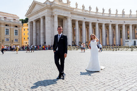 Sposi Novelli posing during a wedding photo shoot in St Peter's Square