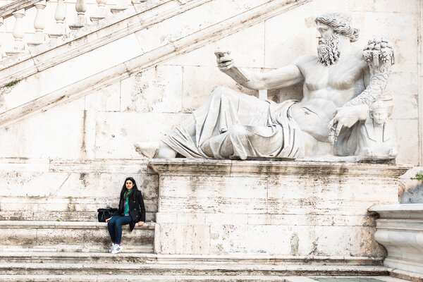 Solo Traveller next to the Nile River God Statue on the Capitoline Hill in Rome