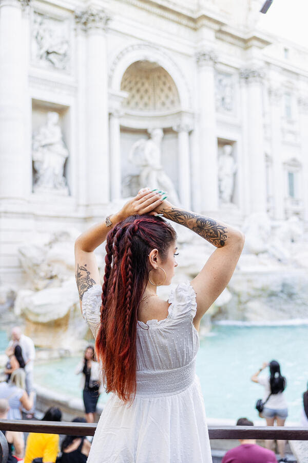 Female Solo Traveller photo session at the Trevi Fountain in Rome at sunrise