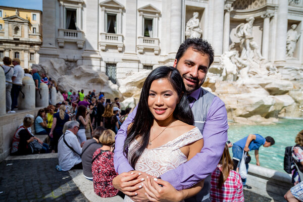 Couple at the Trevi Fountain in a sweet embrace