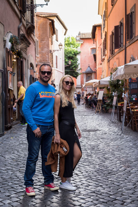 A couple in Trastevere enjoying their vacation in Rome