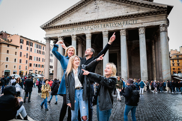 Family joking round in Piazza del Pantheon during their family photoshoot in Rome
