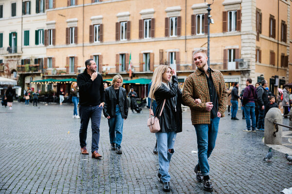 Family walking in Piazza Navona in Rome