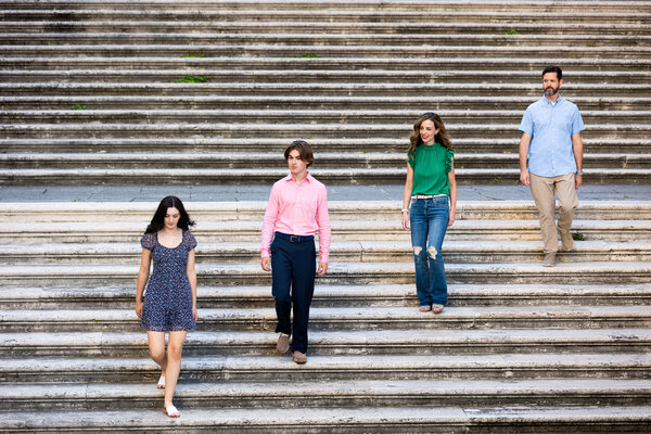 Family of 4 on the Portico del Vignola staircase on the Capitoline Hill during their family photoshoot in Rome