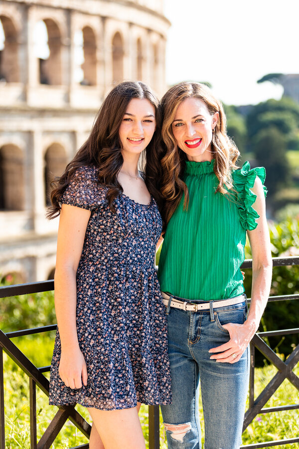 Mother and daughter during their family photo session in Rome with the Colosseum in the background