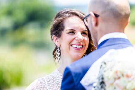 Disarming smile of a beautiful bride during a wedding photo shoot at the Bracciano Lake