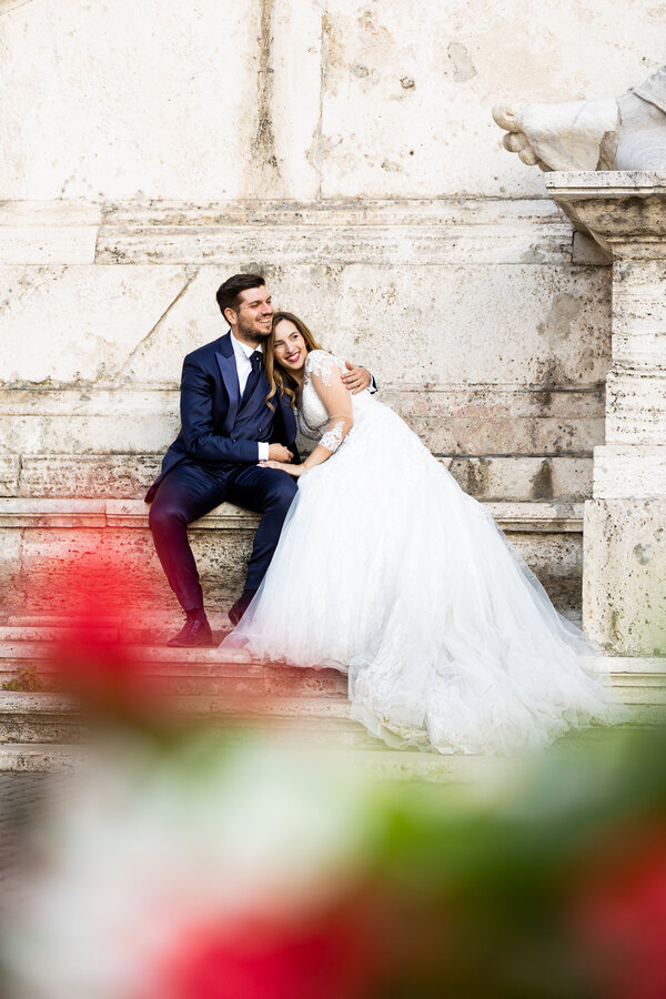 Newly-weds smiling during their wedding photo shoot on the Capitoline Hill