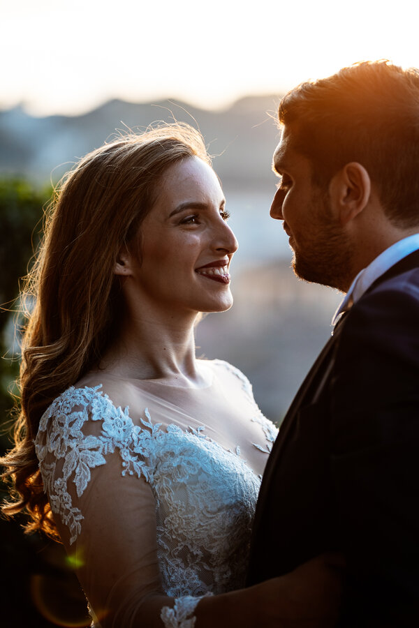 Dark-tone portrait at sunset of a wedding couple in Rome
