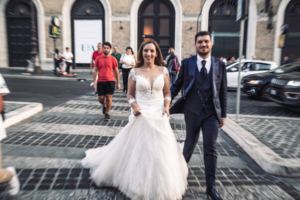 Bride and Groom crossing the road in Rome