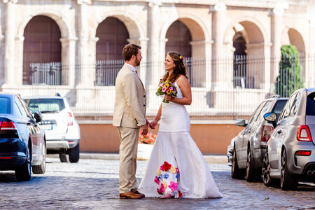 A charming wedding couple with the Colosseum in the background