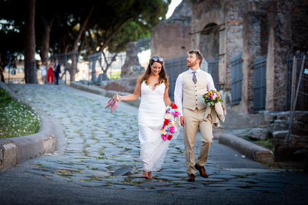 Newly-weds meandering the alleys of the ancient city of Rome