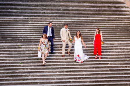 Newly-wed couple and their family walking down a beautiful staircase on the Capitoline Hill in Rome