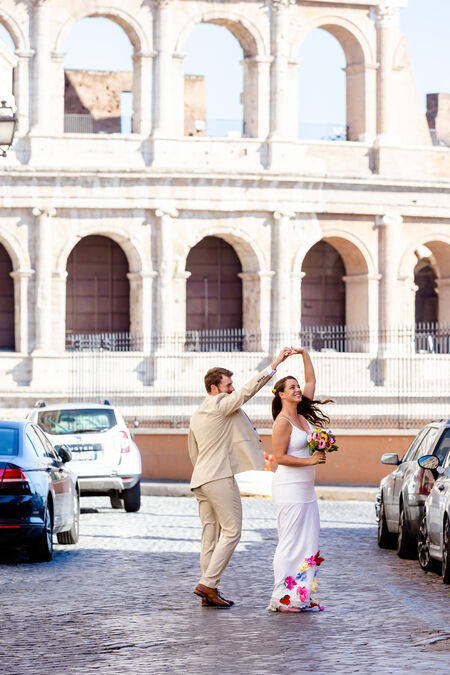 Dancing couple in Rome with the Colosseum in the background