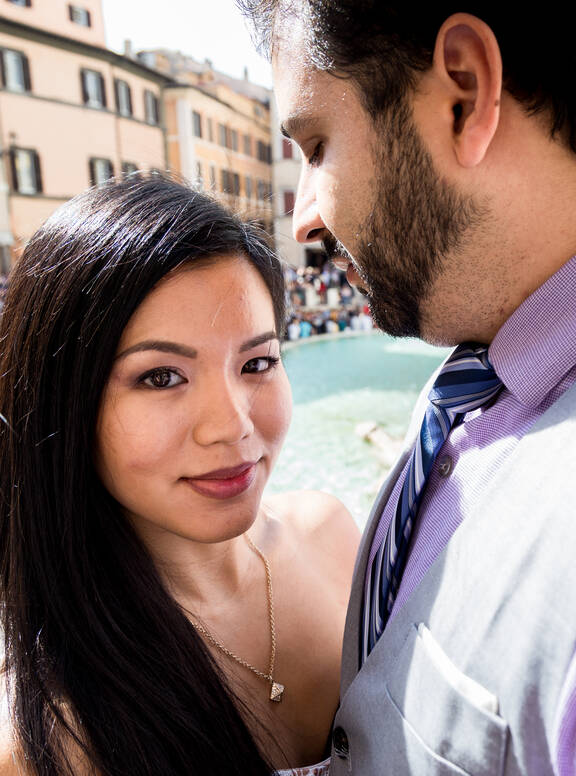 Beautiful couple during a vacation photo shoot at the Trevi Fountain