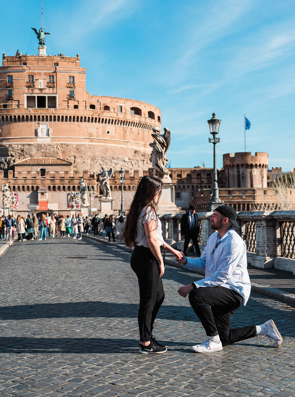 Surprise Proposal Photo Session in Rome on Castel Sant'Angelo Bridge with Valerie and Vincent