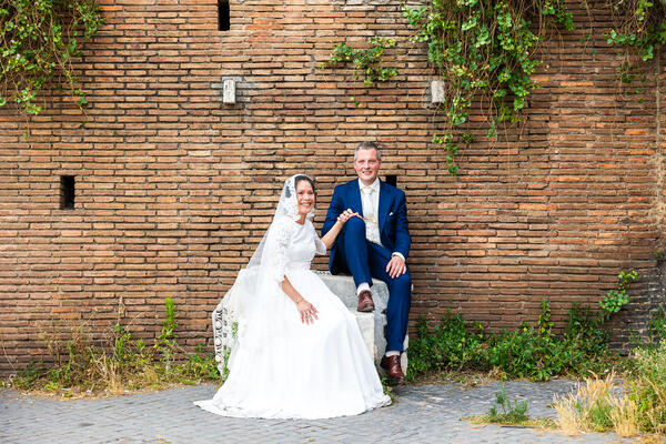 Sposi Novelli couple sitting on marble block on the Capitoline Hill in Rome